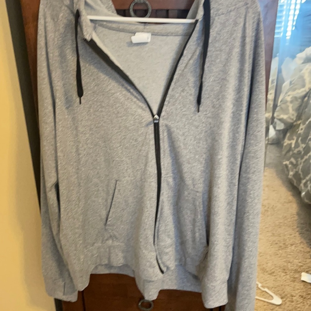 Gray athletic jacket.